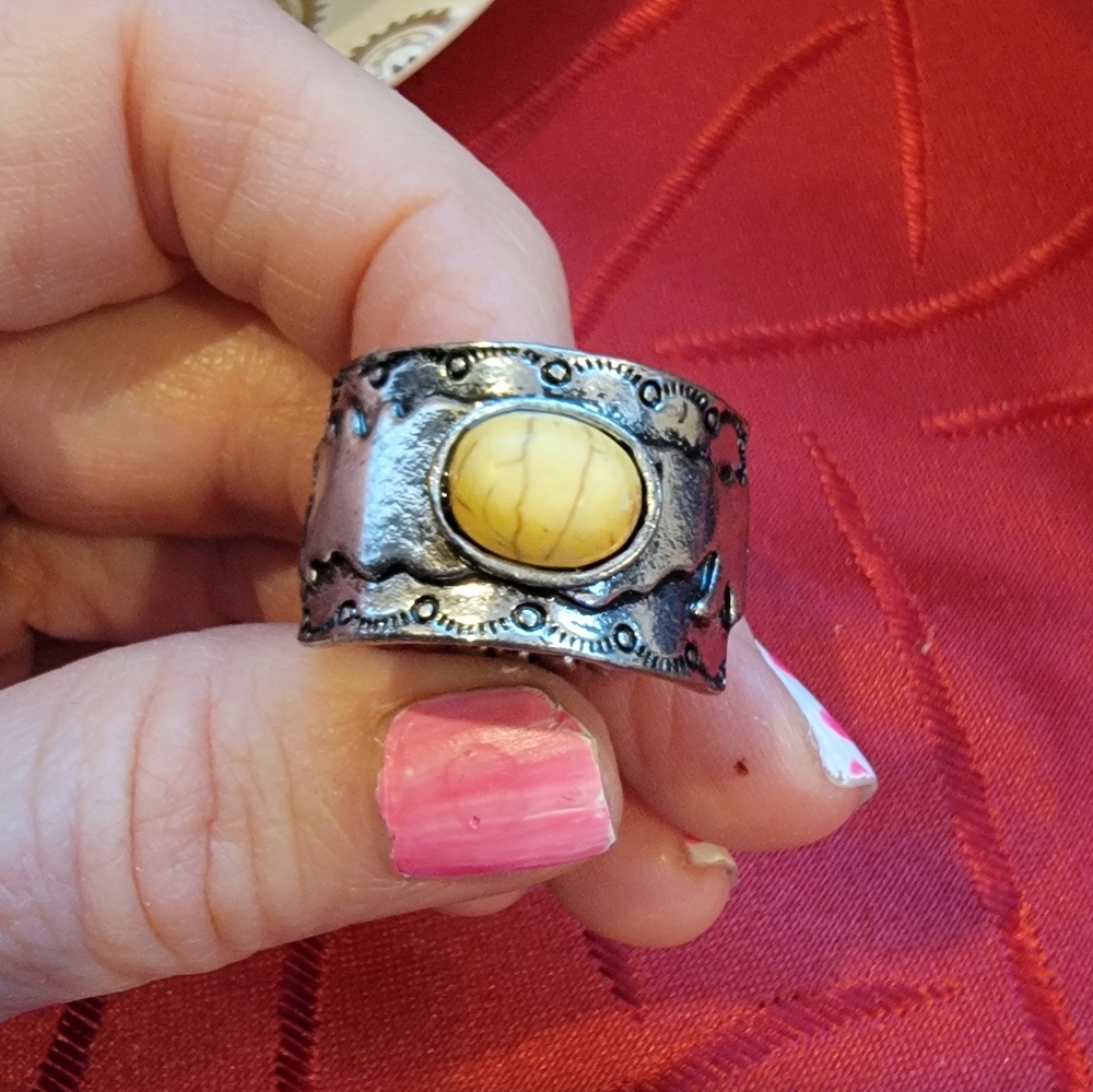 Silver tone ring with yellow stone
